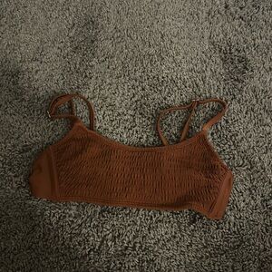 Rust color swimsuit top, size small